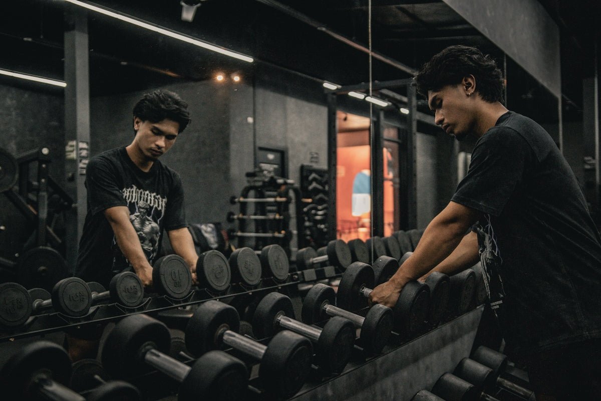 A couple of men working out in a gym